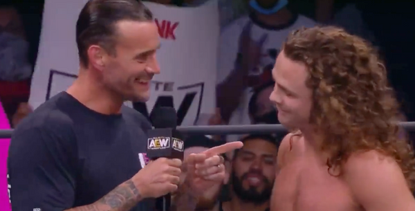 CM Punk points at Jack Perry, saying, in jest, that he's going to kick his ass some day.